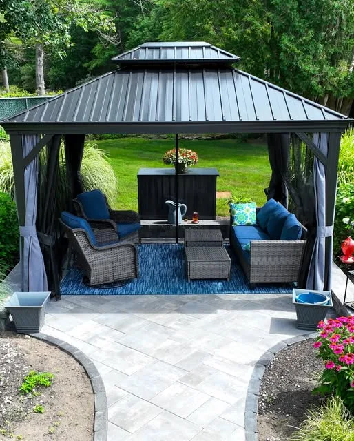 Paver patio under a metal-roof gazebo with outdoor lounge furniture